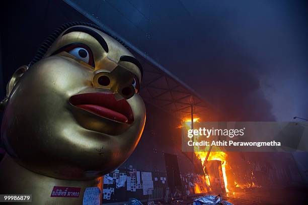 Fire started by red shirt anti-government protesters blazes through the Central World Shopping Mall after Thai military forces dispersed the...