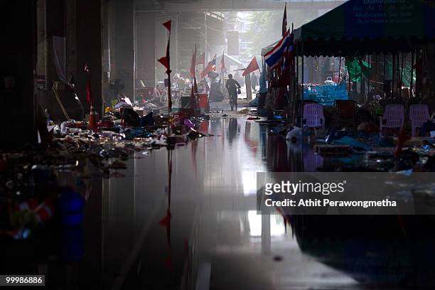 Child cycles past empty tents inside the devastated red shirt camp after Thai military forces dispersed the anti-government protesters on May 19,...