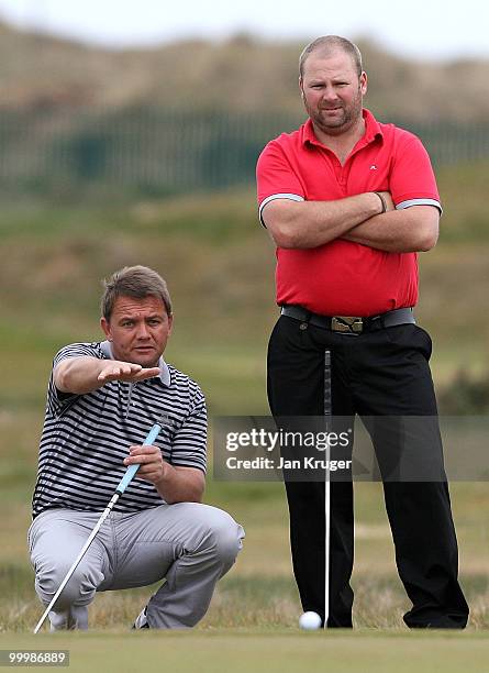 Simon Townendand partner Mark Wilson of Wilpshire line up a put during the Virgin Atlantic PGA National Pro-Am Championship regional final at St...