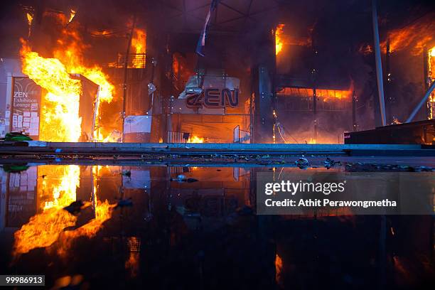 Fire started by red shirt anti-government protesters blazes through the Central World Shopping Mall after Thai military forces dispersed the...