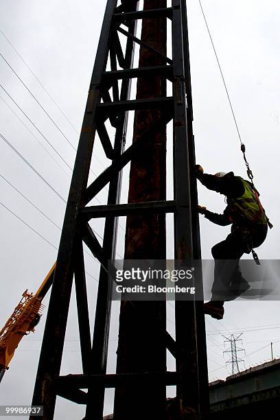Rob Cosellor, a pile driver, works to extend an overpass on the New Jersey Turnpike in Bordentown, New Jersey, U.S., on Wednesday, May 12, 2010. New...