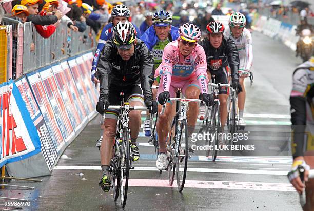 Kazakhstan's Alexandre Vinokourov and Australian Cadel Evans cross the finish line of the11 st stage of the 93rd Giro d'Italia going from Lucera to...