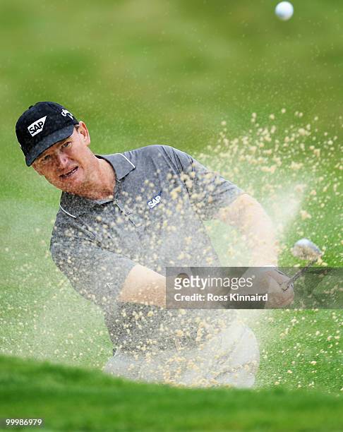 Ernie Els of South Africa plays a bunker shot during the Pro-Am round prior to the BMW PGA Championship on the West Course at Wentworth on May 19,...
