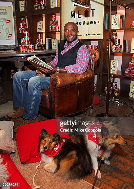 Actor Taye Diggs reads to dogs at the ALPO "Real Dogs Eat Meat" handbook launch at the Chelsea Market on May 19, 2010 in New York City.