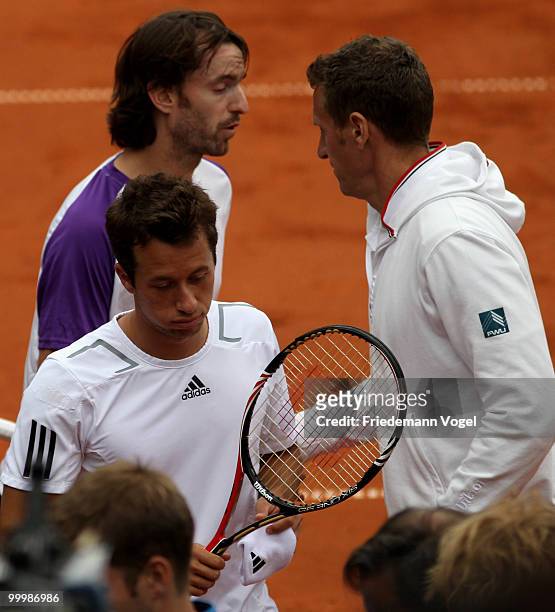 Philip Kohlschreiber , Christopher Kas and national coach Patrick Kuehnen of Germany looks on during the double match against Juan Monaco and Horacio...