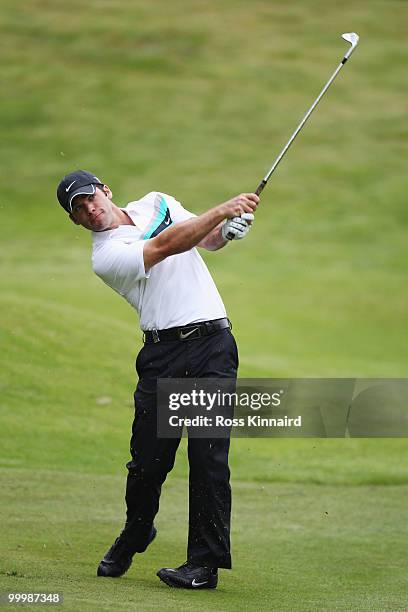 Paul Casey of England plays an iron shot during the Pro-Am round prior to the BMW PGA Championship on the West Course at Wentworth on May 19, 2010 in...