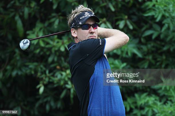 Ian Poulter of England plays a tee shot during the Pro-Am round prior to the BMW PGA Championship on the West Course at Wentworth on May 19, 2010 in...