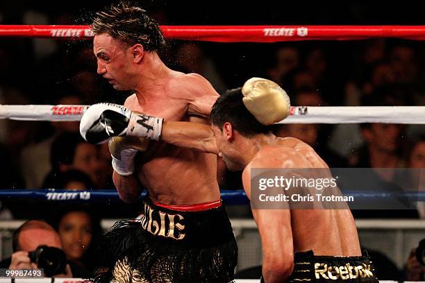 Amir Khan of Great Britain hits Paulie Malignaggi during the WBA light welterweight title fight at Madison Square Garden on May 15, 2010 in New York...