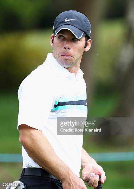 Paul Casey of England reacts to a shot during the Pro-Am round prior to the BMW PGA Championship on the West Course at Wentworth on May 19, 2010 in...