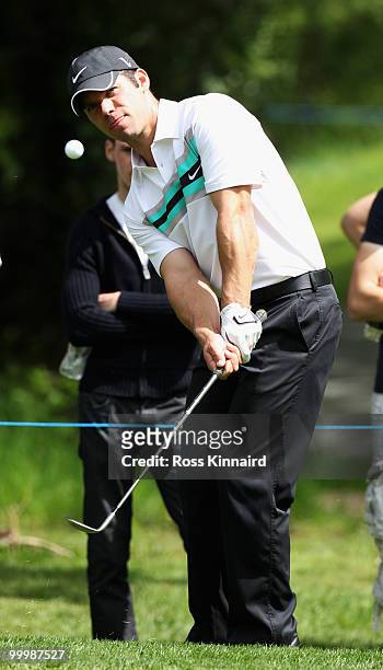 Paul Casey of England plays a chip shot during the Pro-Am round prior to the BMW PGA Championship on the West Course at Wentworth on May 19, 2010 in...