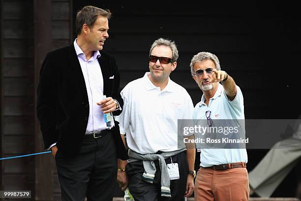 Businessman Peter Jones talks with former F1 boss Eddie Jordan during the Pro-Am round prior to the BMW PGA Championship on the West Course at...