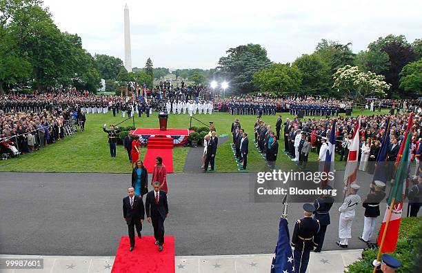 President Barack Obama, front right, and Felipe Calderon, Mexico's president, front left, walk towards the White House during an official state...