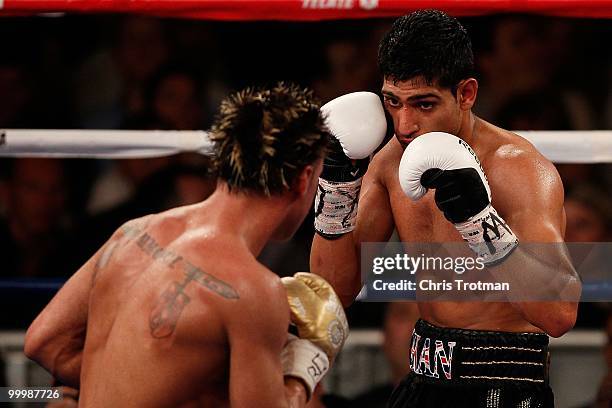 Amir Khan of Great Britain takes on Paulie Malignaggi during the WBA light welterweight title fight at Madison Square Garden on May 15, 2010 in New...