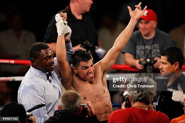 Victor Ortiz celebrates defeating Nate Campbell with referee Steve Willis during the super lightweight fight at Madison Square Garden on May 15, 2010...