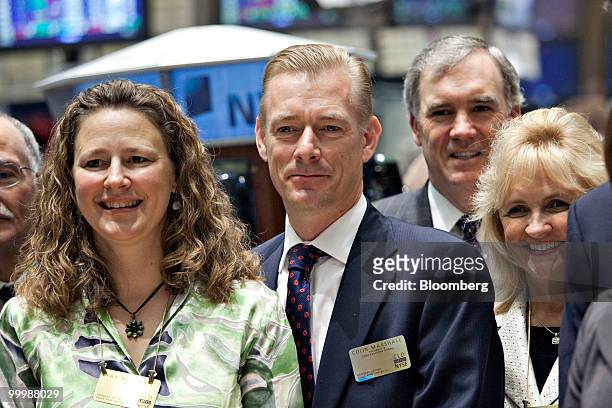 Colin Marshall, president and chief executive officer of Cloud Peak Energy Inc., center, and his wife Fay Marshall, left, stand for a photograph on...