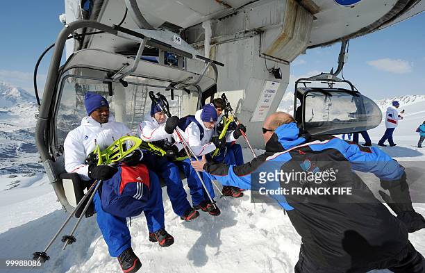 French national football team's players arrive at the top of the Tignes glacier on May 19, 2010 in the French Alps. The French national team should...