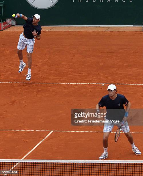 Bob Bryan and Mike Bryan of USA serve during their match against Daniel Gimeno-Traver and Marc Lopez of Spain during day four of the ARAG World Team...