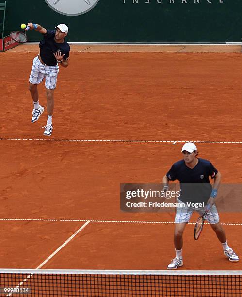 Bob Bryan and Mike Bryan of USA serve during their match against Daniel Gimeno-Traver and Marc Lopez of Spain during day four of the ARAG World Team...