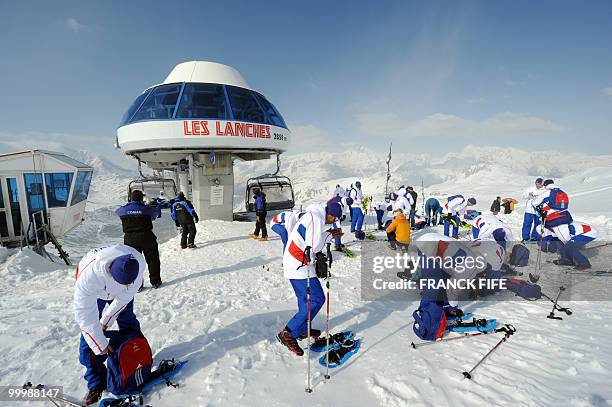 French national football team's players arrive at the top of the Tignes glacier on May 19, 2010 in the French Alps. The French national team should...