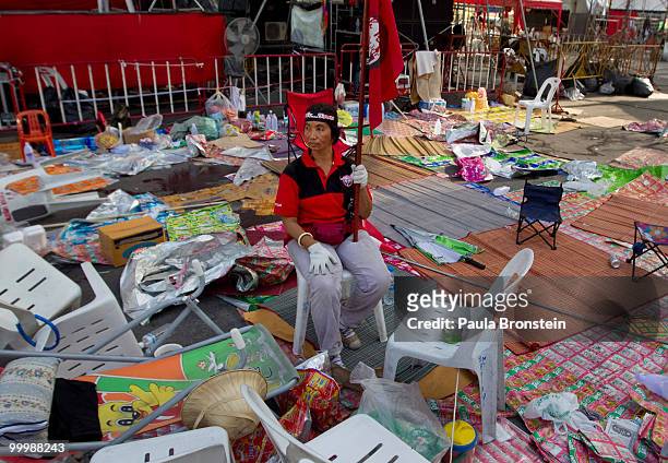 Red shirt anti-government protester sits alone after Thai military forces cleared the main rally site inside the red shirt anti-government...