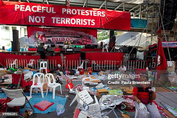 Red shirt anti-government protester sits alone after Thai military forces cleared the main rally site inside the red shirt anti-government...