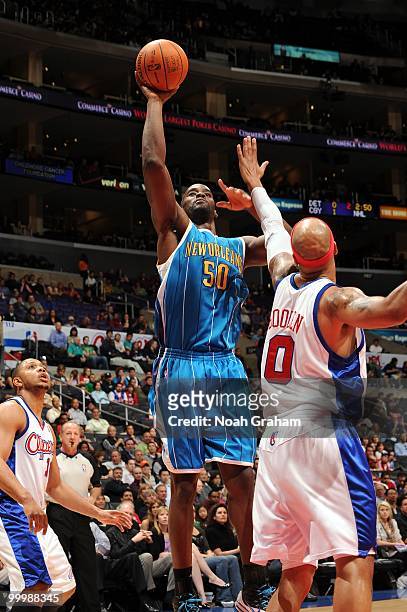 Emeka Okafor of the New Orleans Hornets goes up for a shot against Drew Gooden of the Los Angeles Clippers during the game at Staples Center on March...
