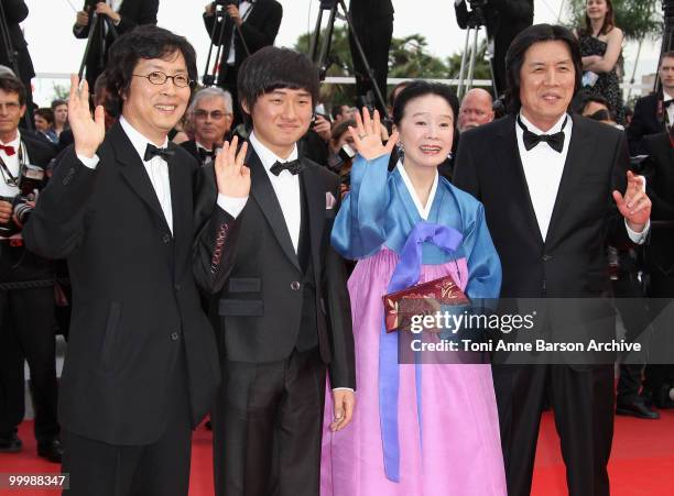 Producer Jun-dong Lee, actor David Lee, actress Jeong-hee Yoon and director Chang-dong Lee attend the premiere of 'Poetry' held at the Palais des...