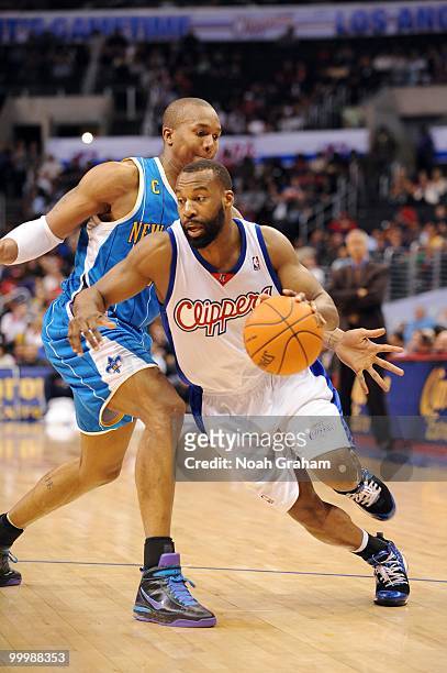 Baron Davis of the Los Angeles Clippers dribbles against David West of the New Orleans Hornets during the game at Staples Center on March 15, 2010 in...