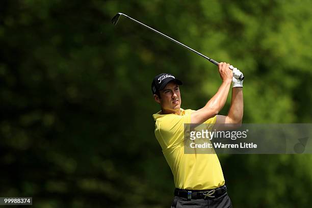 Ross Fisher of England hits his 2nd shot on the 4th hole during the Pro-Am round prior to the BMW PGA Championship on the West Course at Wentworth on...