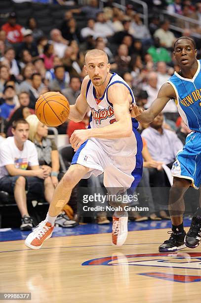 Steve Blake of the Los Angeles Clippers dribbles against the New Orleans Hornets during the game at Staples Center on March 15, 2010 in Los Angeles,...