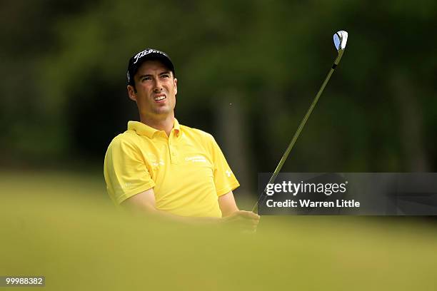 Ross Fisher of England hits an approach shot during the Pro-Am round prior to the BMW PGA Championship on the West Course at Wentworth on May 19,...