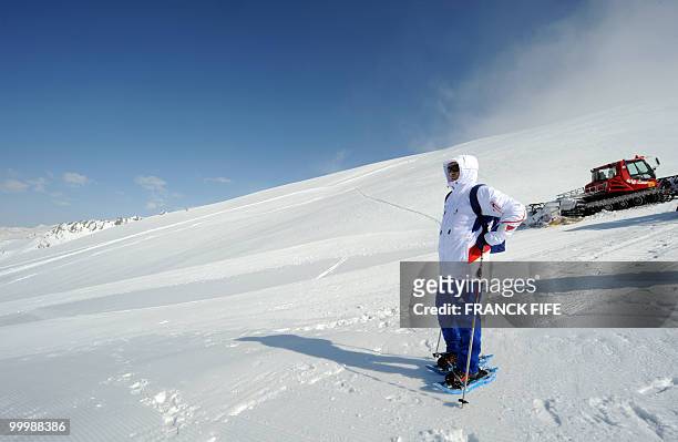 French national football team's coach Raymond Domenech looks at the view upon his arrival at the top of the Tignes glacier on May 19, 2010 in the...