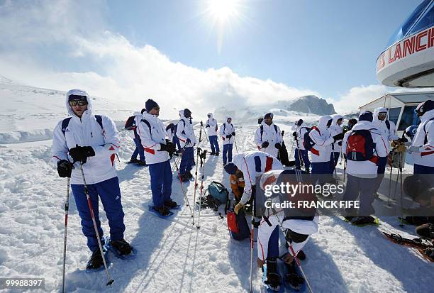 French national football team's coach Raymond Domenech stands with his players upon their arrival at the top of the Tignes glacier on May 19, 2010 in...