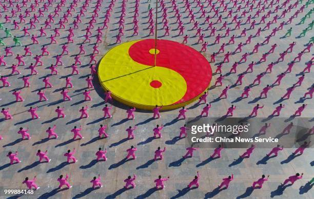 Aerial view of 1,680 Tai Chi enthusiasts from all over the world performing Tai Chi on a square of Guangchang County on July 14, 2018 in Fuzhou,...