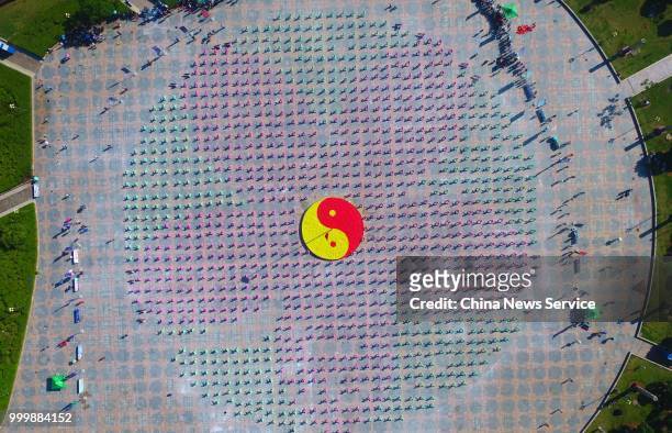 Aerial view of 1,680 Tai Chi enthusiasts from all over the world performing Tai Chi on a square of Guangchang County on July 14, 2018 in Fuzhou,...