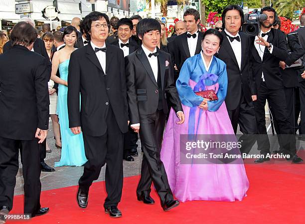 Producer Jun-dong Lee, actor David Lee, actress Jeong-hee Yoon and director Chang-dong Lee attend the premiere of 'Poetry' held at the Palais des...