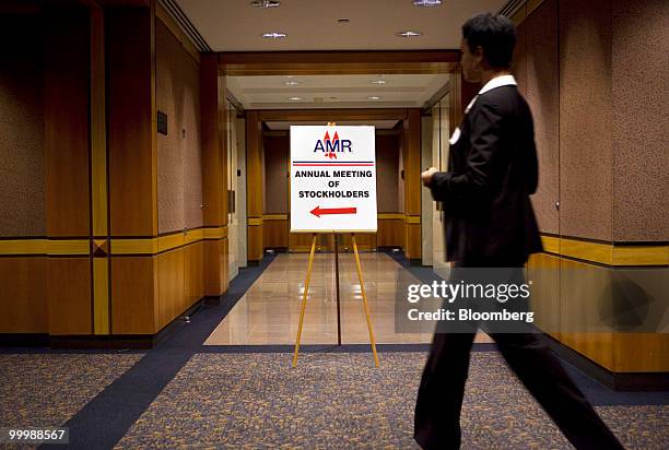 Woman arrives for the annual shareholders meeting of AMR Corp., parent company of American Airlines, in New York, U.S., on Wednesday, May 19, 2010....