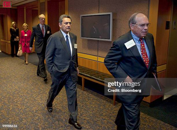 Rajat Gupta, former senior worldwide partner at McKinsey & Co., and a board member of AMR Corp., the parent company of American Airlines, center,...