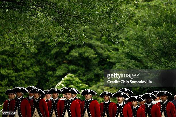 The U.S. Army's Old Guard Fife and Drum Corps stand ready to march during a welcome ceremony for the president of Mexico on the South Lawn of the...
