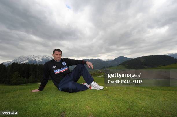 England footballer Jamie Carragher poses for photographers outside the team hotel in Irdning, Austria on May 19, 2010 ahead of the World Cup Finals...