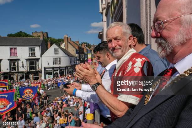 Labour Leader Jeremy Corbyn applauds as he stands on the balcony of the County Hotel watching as colliery bands pass below during the 134th Durham...