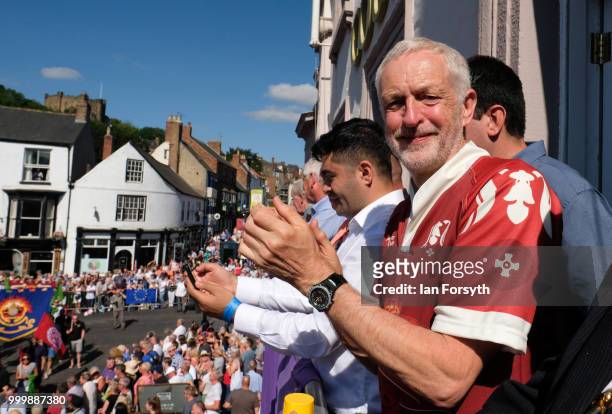 Labour Leader Jeremy Corbyn applauds as he stands on the balcony of the County Hotel watching as colliery bands pass below during the 134th Durham...