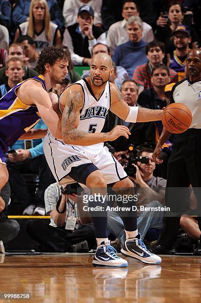Carlos Boozer of the Utah Jazz dribbles against Pau Gasol of the Los Angeles Lakers in Game Four of the Western Conference Semifinals during the 2010...