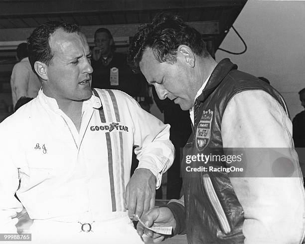 Foyt talks with noted mechanic Herb Nab.