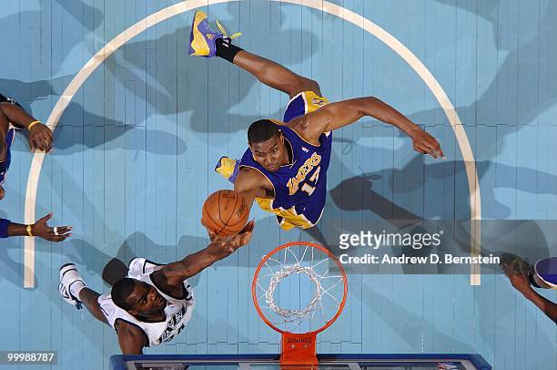 Andrew Bynum of the Los Angeles Lakers goes up for the ball against Paul Millsap of the Utah Jazz in Game Four of the Western Conference Semifinals...