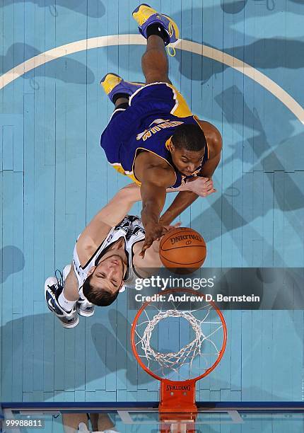 Andrew Bynum of the Los Angeles Lakers goes to the basket against Kosta Koufos of the Utah Jazz in Game Four of the Western Conference Semifinals...