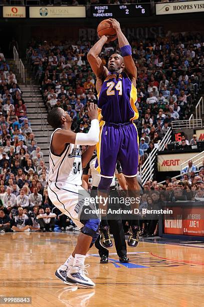 Kobe Bryant of the Los Angeles Lakers shoots a jump shot against C.J. Miles of the Utah Jazz in Game Four of the Western Conference Semifinals during...
