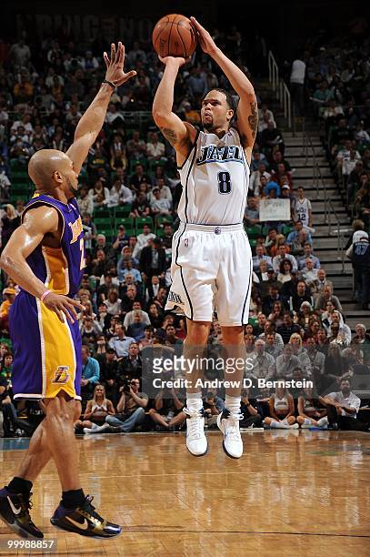 Deron Williams of the Utah Jazz shoots a jump shot against Derek Fisher of the Los Angeles Lakers in Game Four of the Western Conference Semifinals...