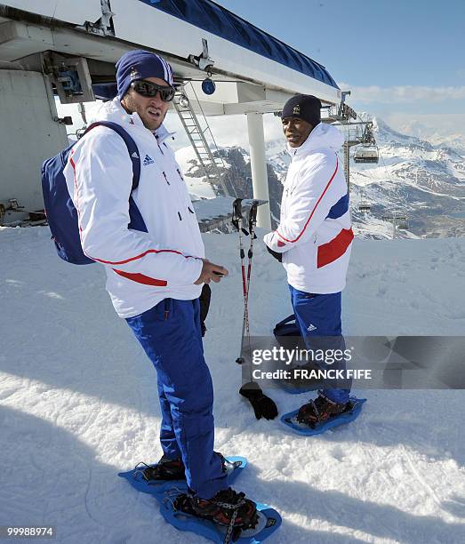 French national football team's forwards Andre-Pierre Gignac and Djibrill Cisse are pictured at the top of the Tignes glacier on May 19, 2010 in the...