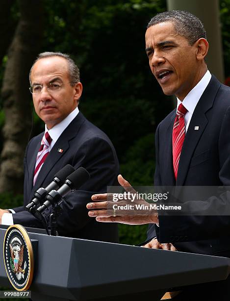 President Barack Obama answers a question during a joint press conference with Mexican President Felipe Calderon in the Rose Garden of the White...